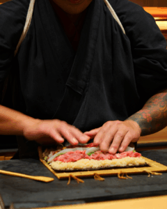 Chef Masa making sushi