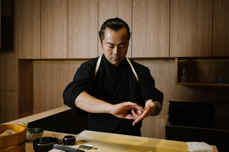 Chef Masa making sushi