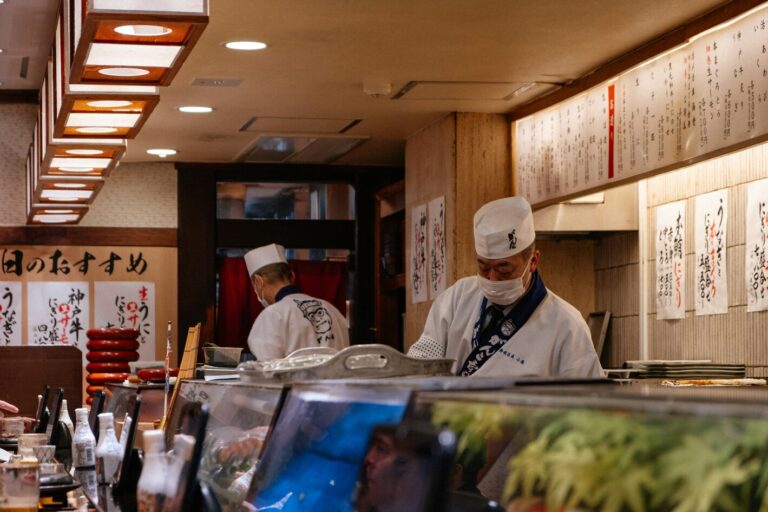 Japan Cuisine : Chef preparing omakase behind the counter, showcasing skill, precision, and personal touch.