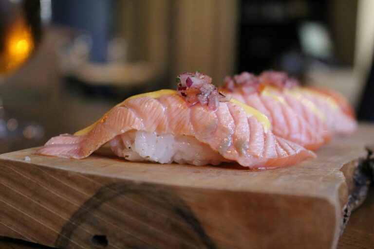 Japan Cuisine : A delicate sushi platter under soft lighting, highlighting the artistry of omakase.