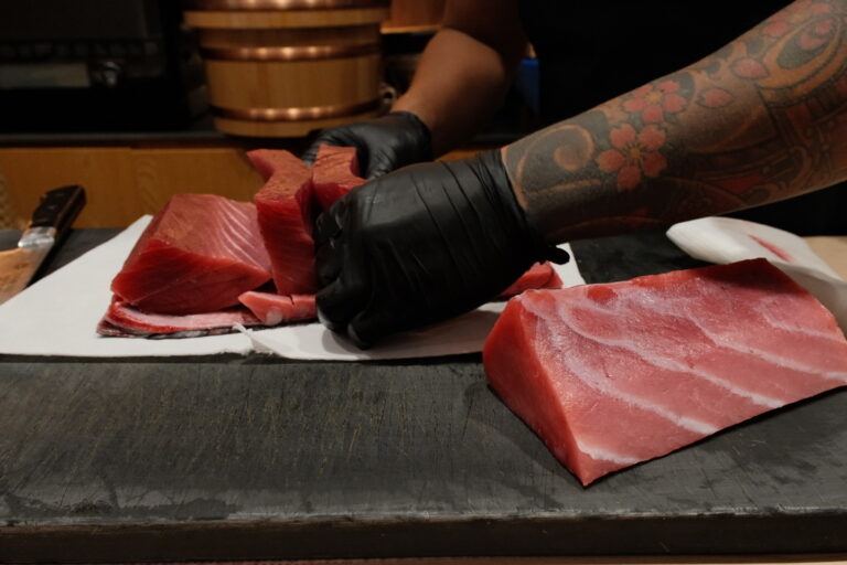 Japan Cuisine Singapore : Ritualistic preparation of sushi ingredients in a traditional kitchen setting.