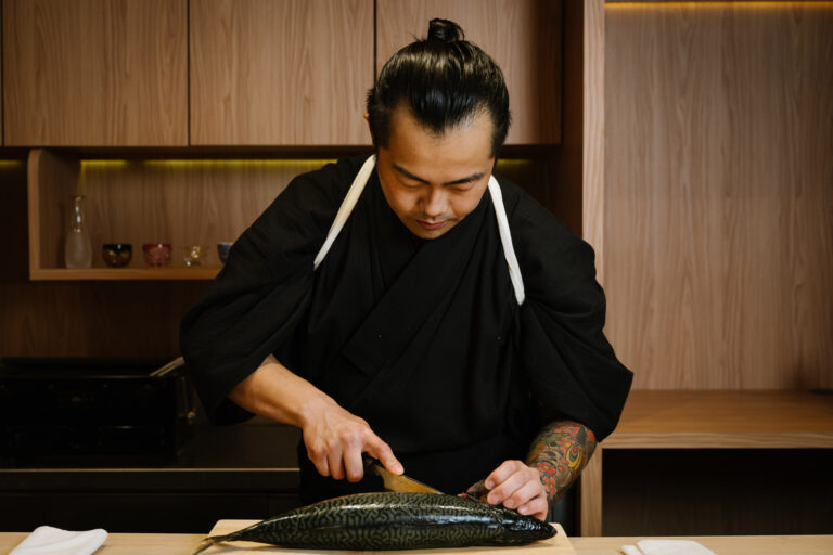 Japan Cuisine Singapore : Elegant wooden counter setting for a personalized omakase experience.