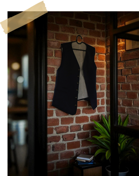 Sushi Masa First Year: Chef Masa’s vest hanging neatly on the wall, symbolising dedication and craft.