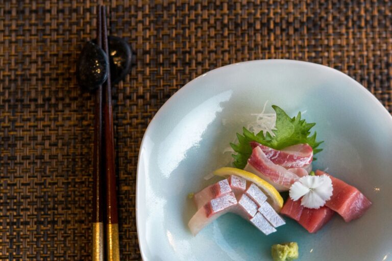 A close-up view of fresh tuna, sea urchin, and seasonal fish, showcasing the culinary mastery of Japanese cuisine. This dish highlights the use of the freshest ingredients, perfect for a fine dining experience in a Japanese restaurant in Singapore.