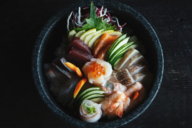 A vibrant arrangement of seasonal Japanese ingredients is displayed, showcasing the artistry and culinary mastery involved in kaiseki preparation. This exquisite presentation highlights the freshest produce, reflecting the elegance and tradition of Japanese cuisine, perfect for a fine dining experience in a Japanese restaurant in Singapore.