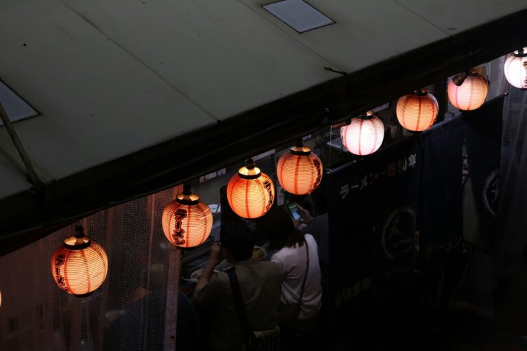 Japanese Food in Singapore : Diners enjoying authentic ramen in a cosy, minimalist Japanese restaurant.
