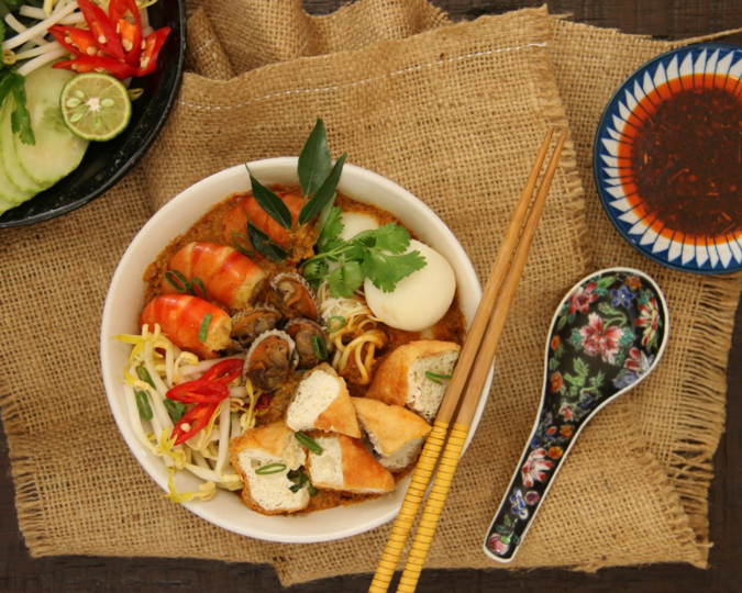 Singapore's best food: A colourful spread of Peranakan dishes featuring intricate flavours and heritage-inspired presentation.