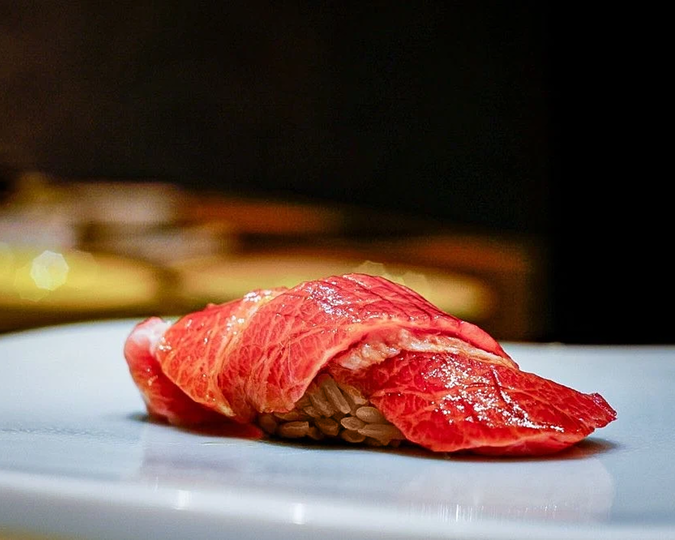 Signature sushi from Sushi Ayumu, meticulously prepared with seasonal ingredients and refined presentation.