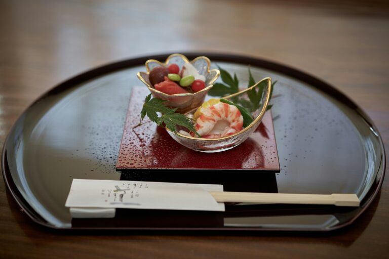 Elegant dining space inside a Michelin-starred Japanese restaurant, featuring refined décor and meticulous presentation that highlights the artistry of Japanese cuisine.