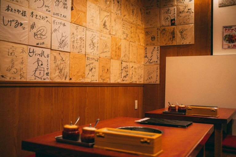 Interior of a Japanese restaurant blending traditional Japanese elements with multicultural influences, creating a warm and diverse dining atmosphere