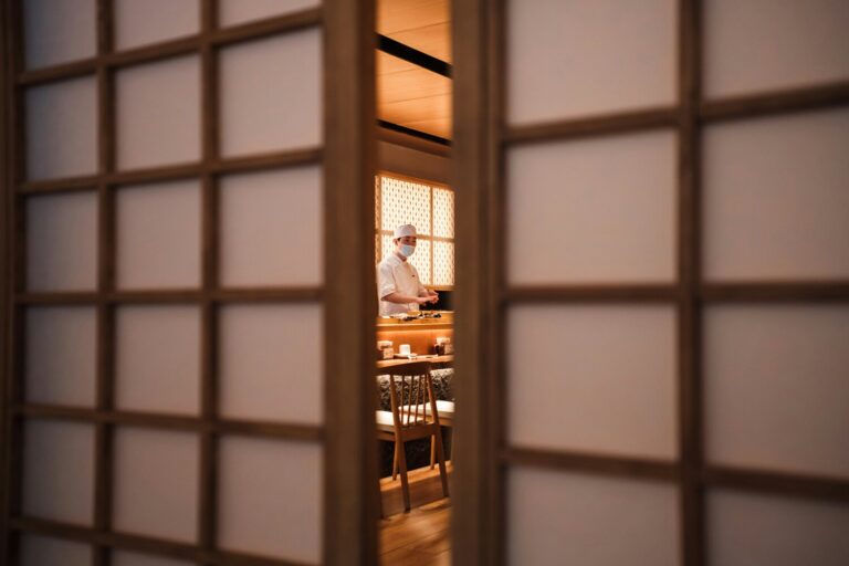 Japanese Restaurant Private Room: A traditional Japanese private dining room featuring tatami mats and a low table, creating an elegant and intimate atmosphere for an exclusive dining experience. This serene space is designed for guests to enjoy a culinary journey, surrounded by the tranquility of a Japanese garden.