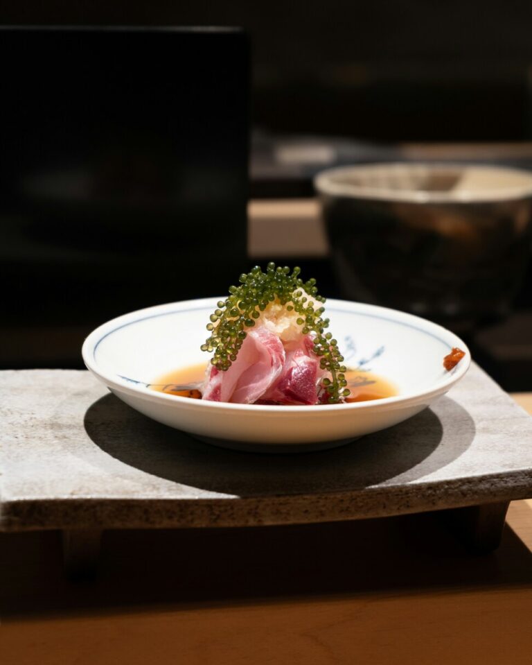 An assortment of fresh omakase ingredients laid neatly on the counter, showcasing premium seafood and seasonal produce prepared by the chef before service.