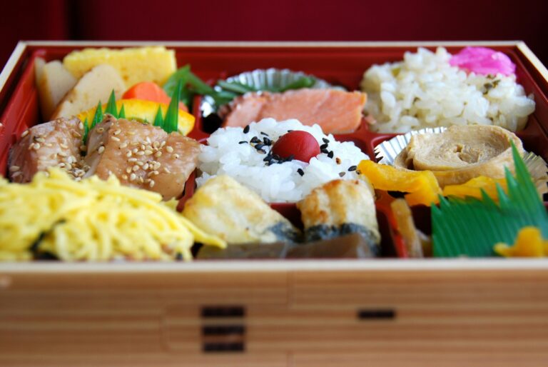 Japanese Food in SG : An assortment of beautifully crafted Japanese bentos displayed on a counter, combining traditional tastes with Singapore’s fast-paced, modern dining culture.