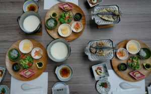Japanese Food in SG : A beautifully arranged Japanese dining table showcasing a culinary tapestry of traditional dishes, highlighting the artistry and balance of Japan’s food culture.