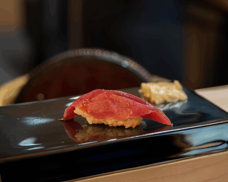 Elegant omakase-style sushi from Sushi Masa, featuring seasonal seafood served on a minimalist ceramic plate.