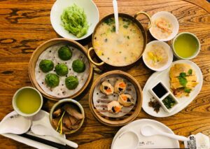 Restaurants in Singapore: A vibrant Chinese restaurant table filled with steaming baskets of dim sum, showcasing traditional Cantonese dining culture.