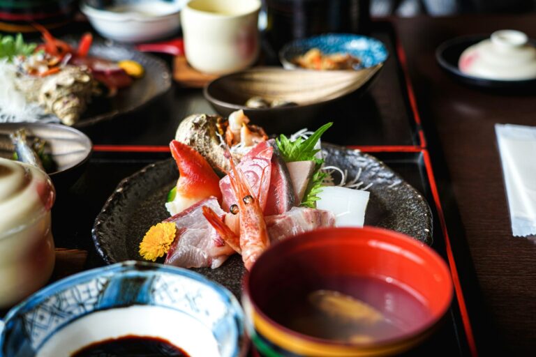 Slices of fresh sashimi arranged gracefully on a chilled plate, highlighting the vibrant colours and delicate texture of premium Japanese seafood