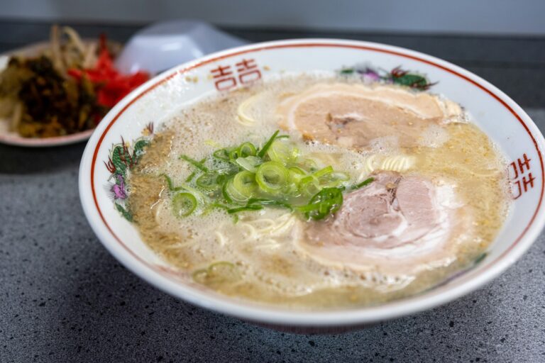A steaming bowl of Japanese ramen served in Singapore, highlighting its rich broth, handmade noodles, and diverse culinary foundations inspired by traditional Japanese cooking.