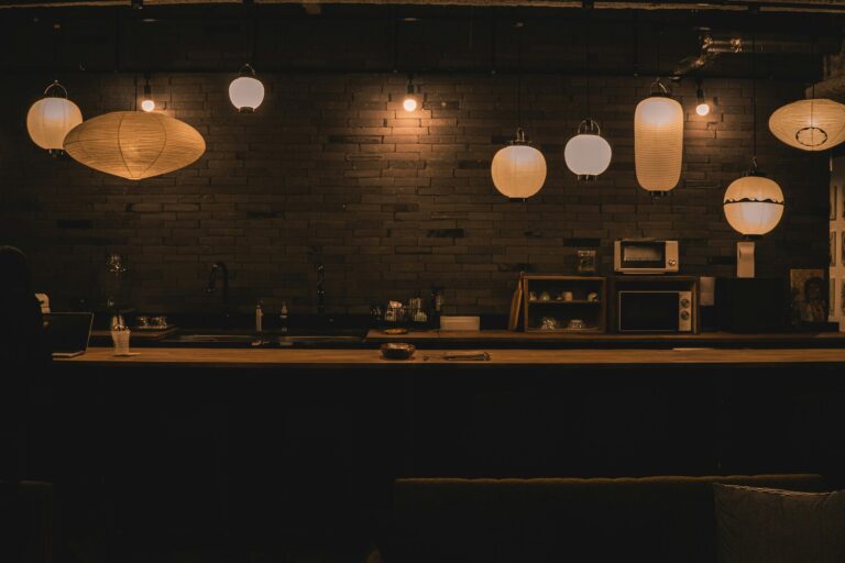 A serene omakase counter in Singapore, where the chef crafts each sushi piece in front of diners to deliver an intimate, curated experience.