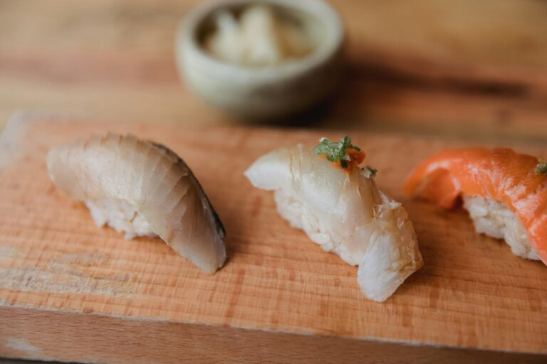 The image features a beautifully plated seasonal sashimi dish, showcasing the chef's artistic presentation skills with an array of fresh ingredients, including delicate slices of seasonal fish and vibrant garnishes. This exquisite dish is a highlight of the omakase menu, offering diners a memorable experience in Japanese cuisine.