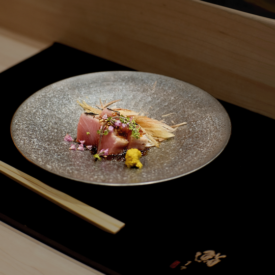 A seasonal omakase course showcasing premium ingredients at their peak, arranged beautifully to reflect the chef’s artistic vision and mastery.
