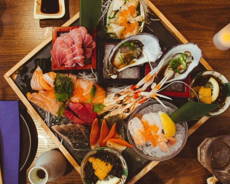 A refined plate of fresh sashimi served in a Japanese restaurant in Singapore, showcasing thinly sliced fish with pristine texture and vibrant colour.