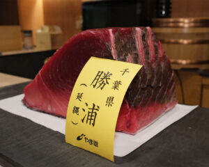 Premium Japanese tuna displayed on a preparation table at Sushi Masa, showing rich colour and fresh texture.