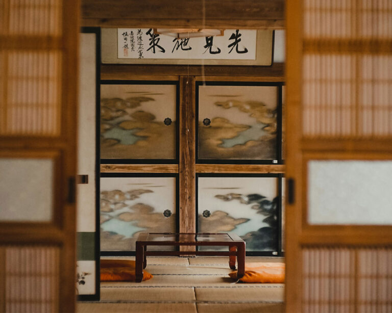 Traditional tatami-style private dining rooms with low tables and floor seating, offering an authentic Japanese dining experience in a calm and serene setting.